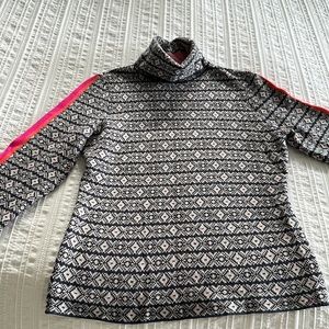 Navy and white turtleneck sweater.Pink and orange stripes on the sleeves.